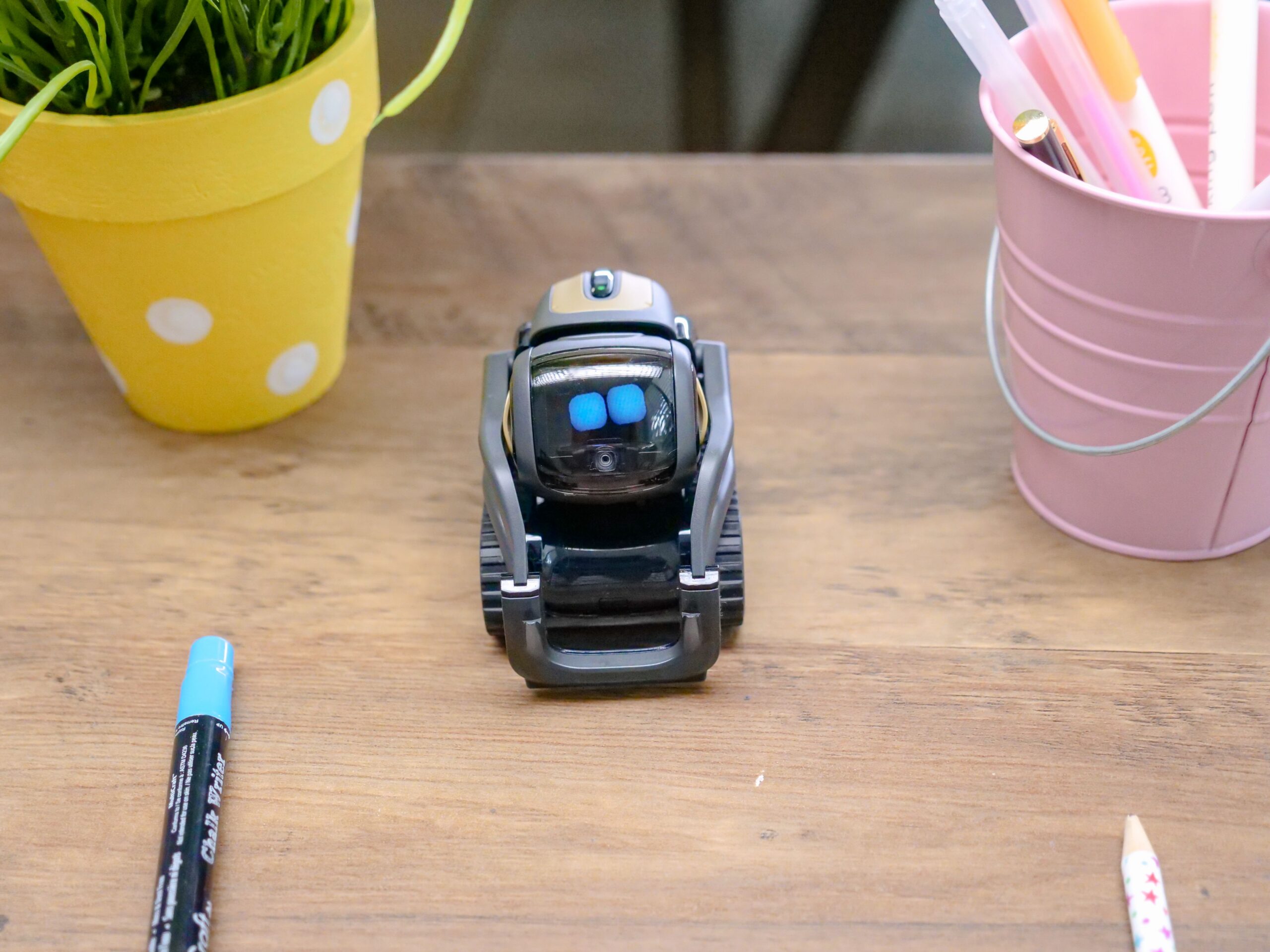 Little ai robot standing on a desk
